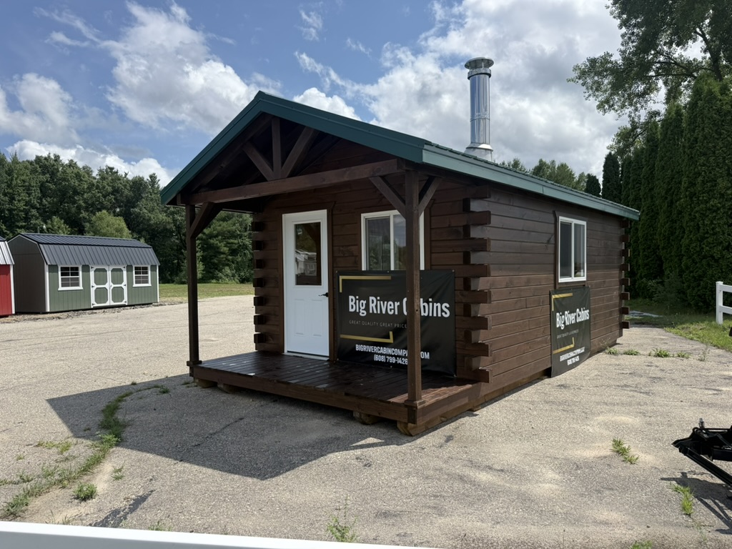Front of the 12×24 square log cabin with covered porch at the Barron display location