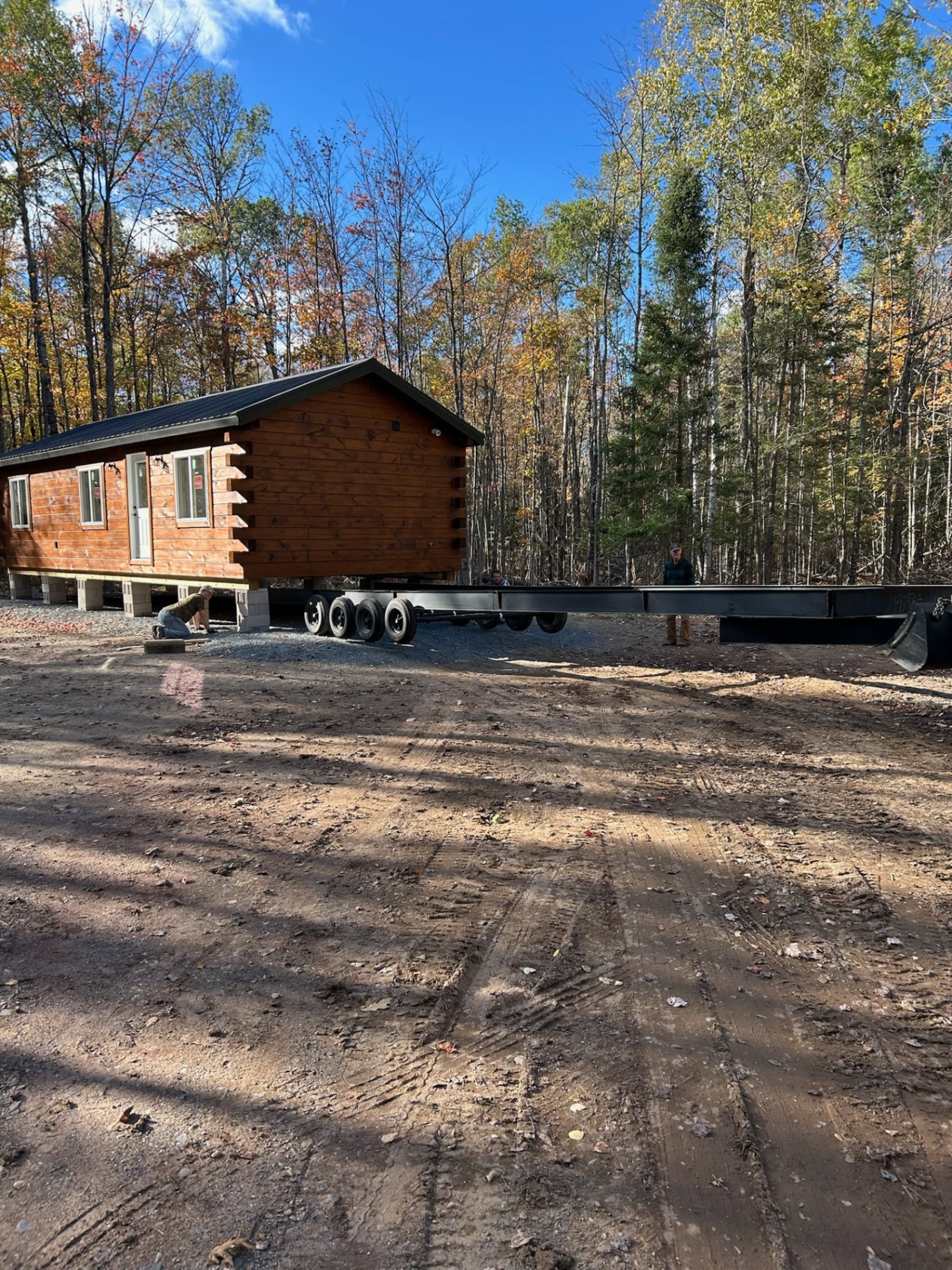 Single-level cabin being set off the delivery trailer