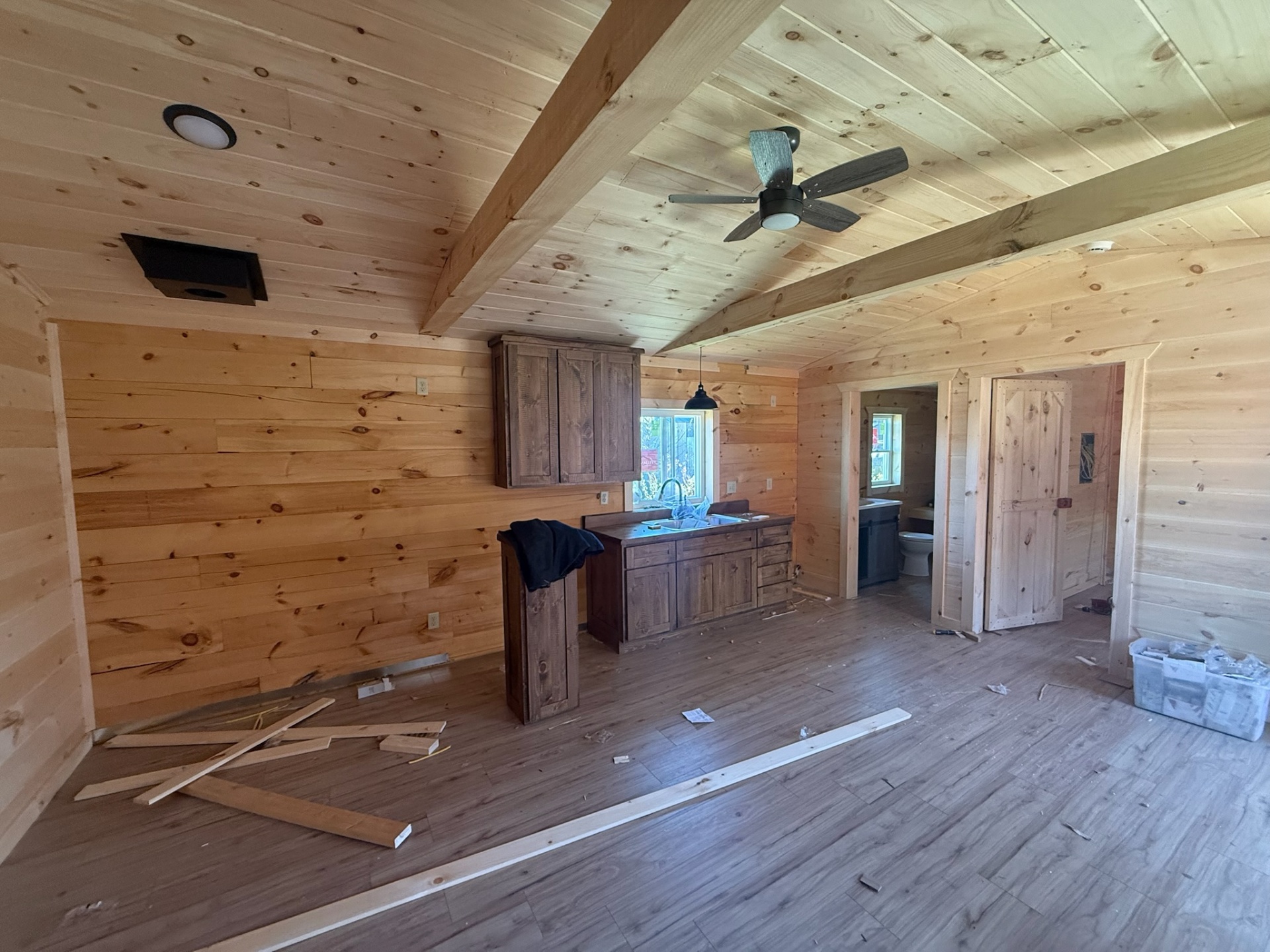 Interior with kitchen, vaulted pine ceiling and beam